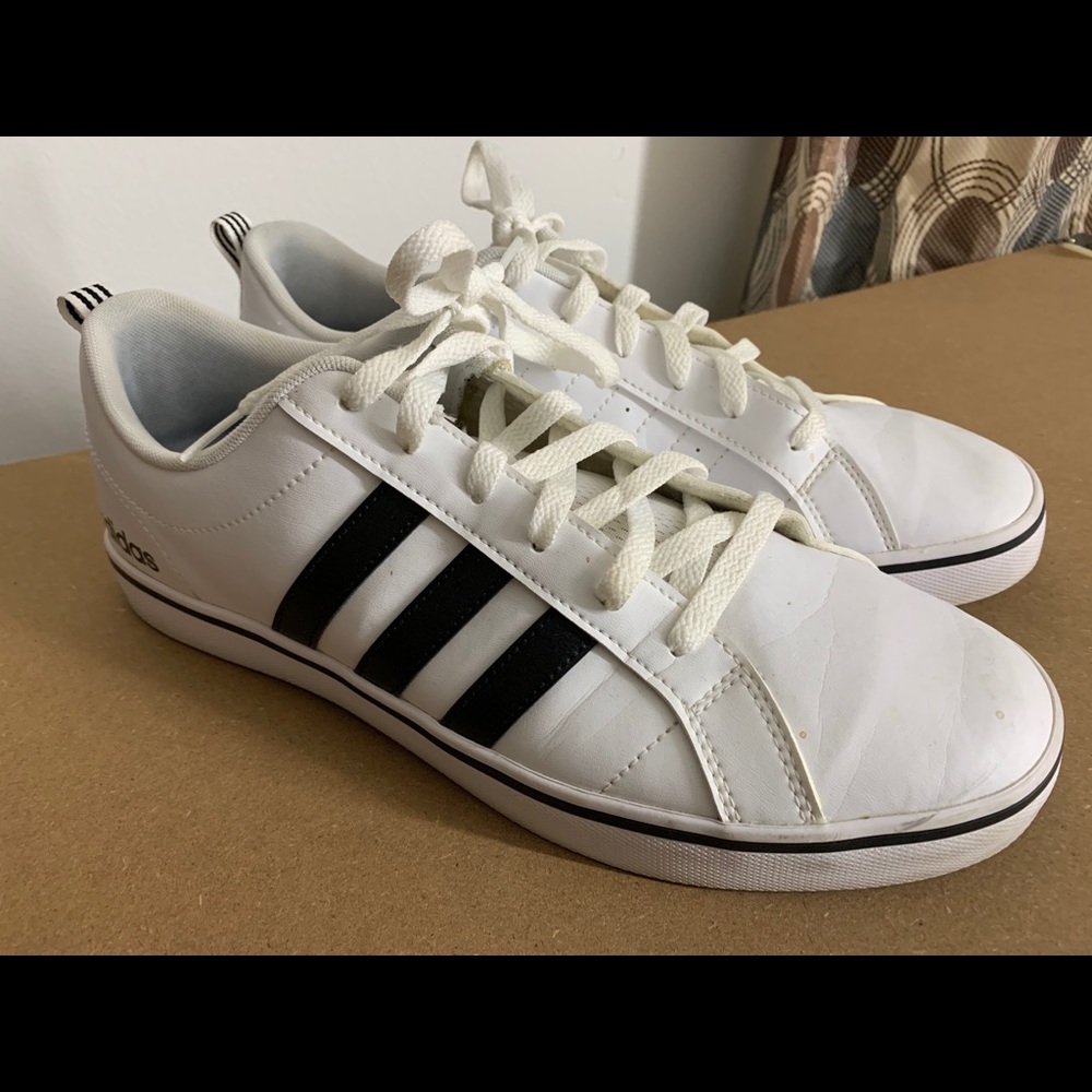 Men’s white and black striped Adidas trainers